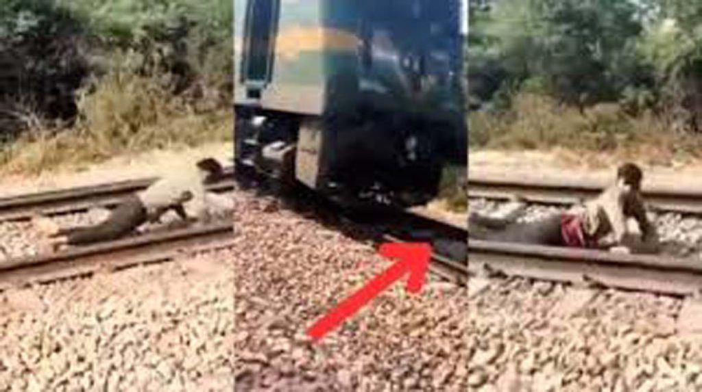 Train Ka Video: ट्रेन आई तो पटरियों पर लेट गया लड़का, फिर जो दिखा होश ही उड़ जाएंगे | देखें वीडियो
