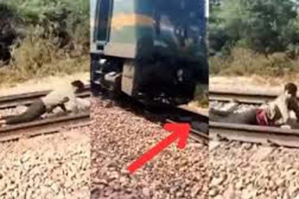 Train Ka Video: ट्रेन आई तो पटरियों पर लेट गया लड़का, फिर जो दिखा होश ही उड़ जाएंगे | देखें वीडियो